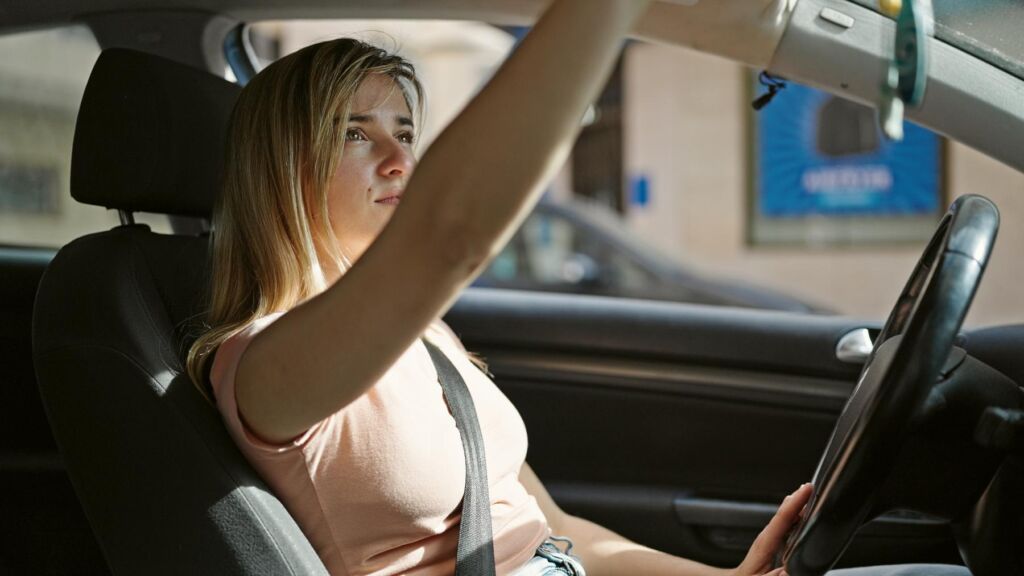 Teen driver following safe driving tips